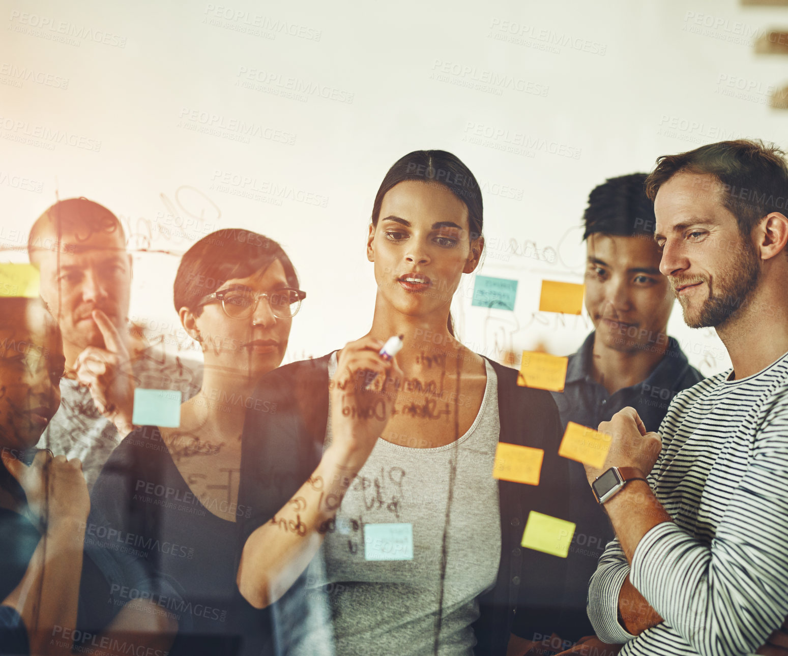 Buy stock photo Teamwork, unity and thinking group of business people working on a project together. Discovery, innovation by creative team planning and brainstorming, sharing ideas and writing on sticky notes 