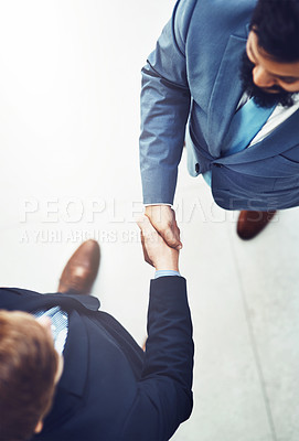 Buy stock photo Handshake, agreement and business men in office with b2b deal, collaboration or partnership. Professional, meeting and aerial view of male lawyers shaking hands for greeting or welcome in workplace.