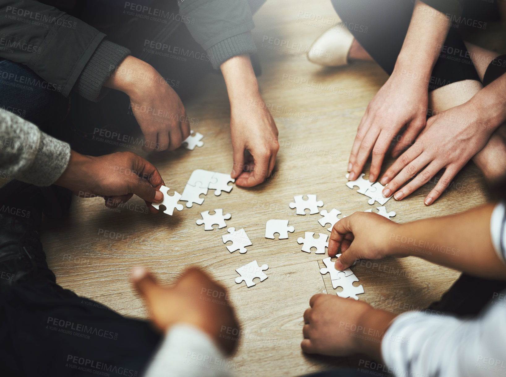 Buy stock photo People, teamwork and hands with puzzle on floor for problem solving, support and integration of strategy. Team, diversity and training with jigsaw for creative interaction, collaboration and learning