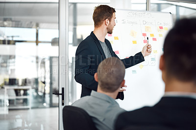 Buy stock photo Shot of businesspeople having a meeting in a boardroom