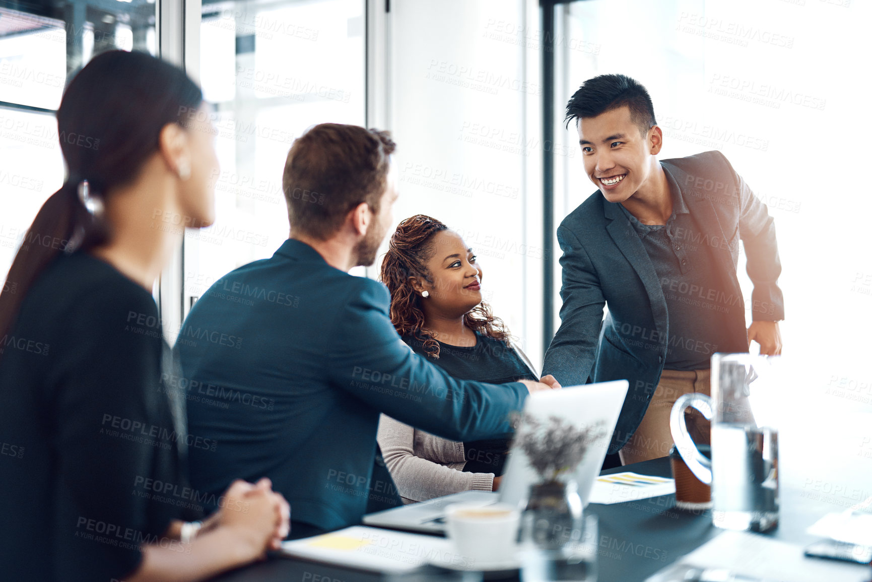 Buy stock photo Men, handshake and welcome to meeting at office with smile for introduction, crm and respect. Business people, shaking hands and happy with diversity, collaboration and onboarding for job at agency