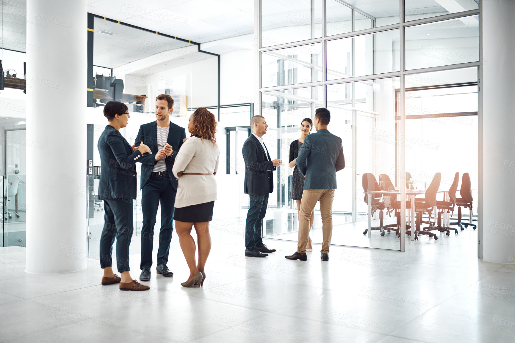 Buy stock photo Shot of businesspeople having a conversation in the office