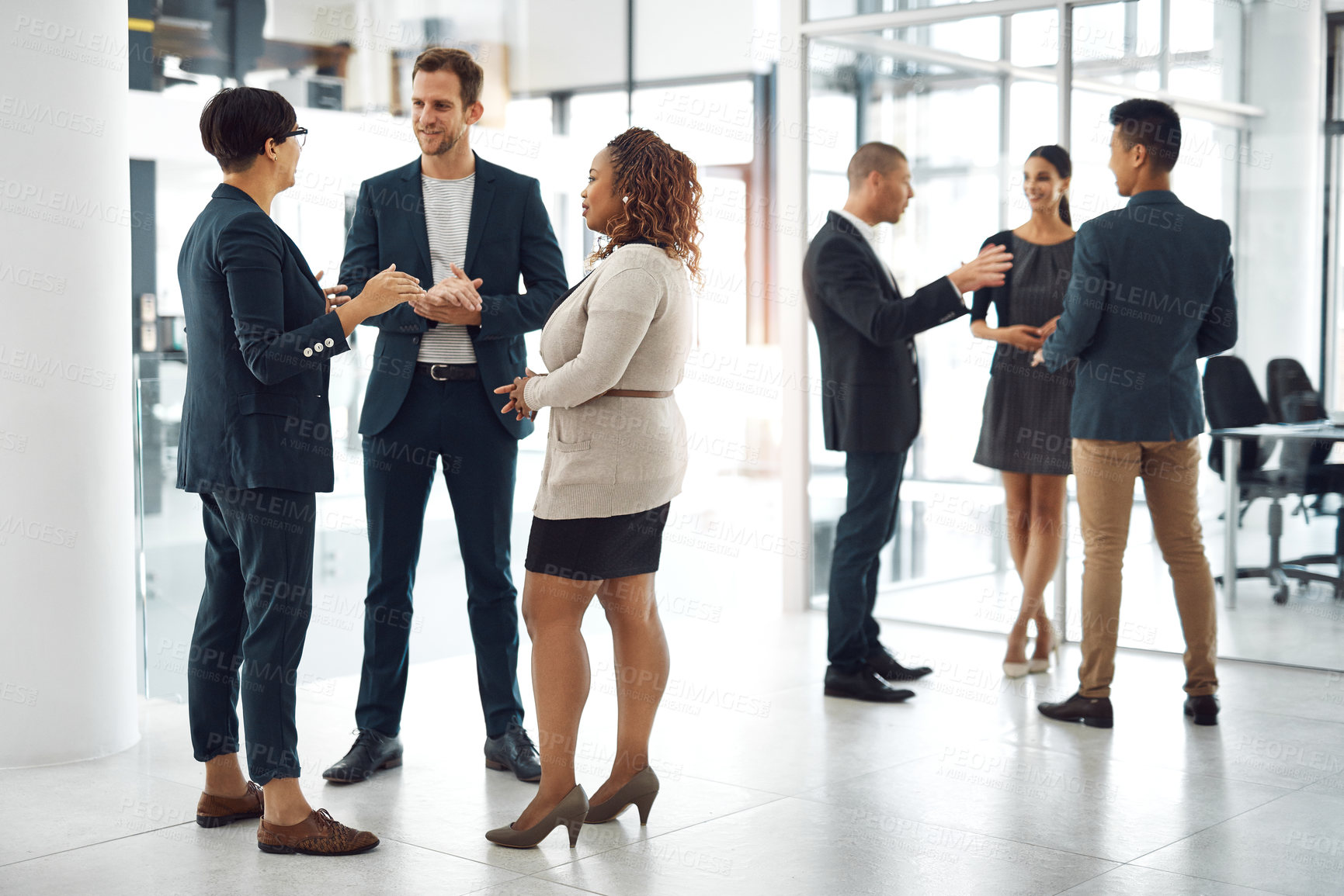 Buy stock photo Shot of businesspeople having a conversation in the office