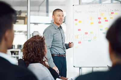 Buy stock photo Man, whiteboard and sticky notes for schedule in office, meeting and boardroom for progress. Male person, mentor and speaking to staff on productivity in workplace, charts and brainstorming project