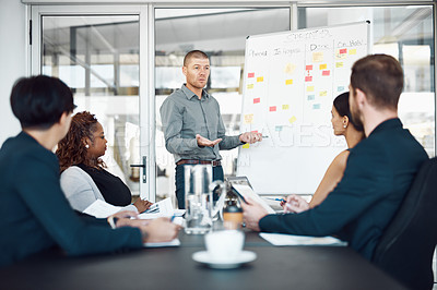 Buy stock photo Presentation, colleagues with chart and planning in a business meeting of their modern workplace office together. Teamwork or collaboration, ideas or data review and coworkers in a conference room