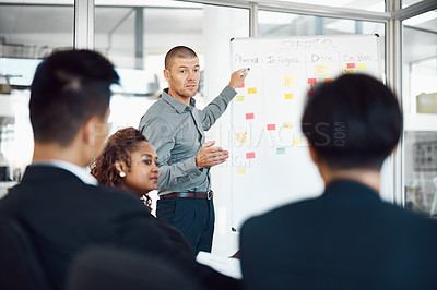 Buy stock photo Man, presentation and sticky notes on whiteboard for planning, timeline and brainstorming strategy in office. Speaker, meeting and group training in boardroom for goals, collaboration and instruction