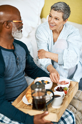Buy stock photo Shot of a senior married couple having breakfast at home