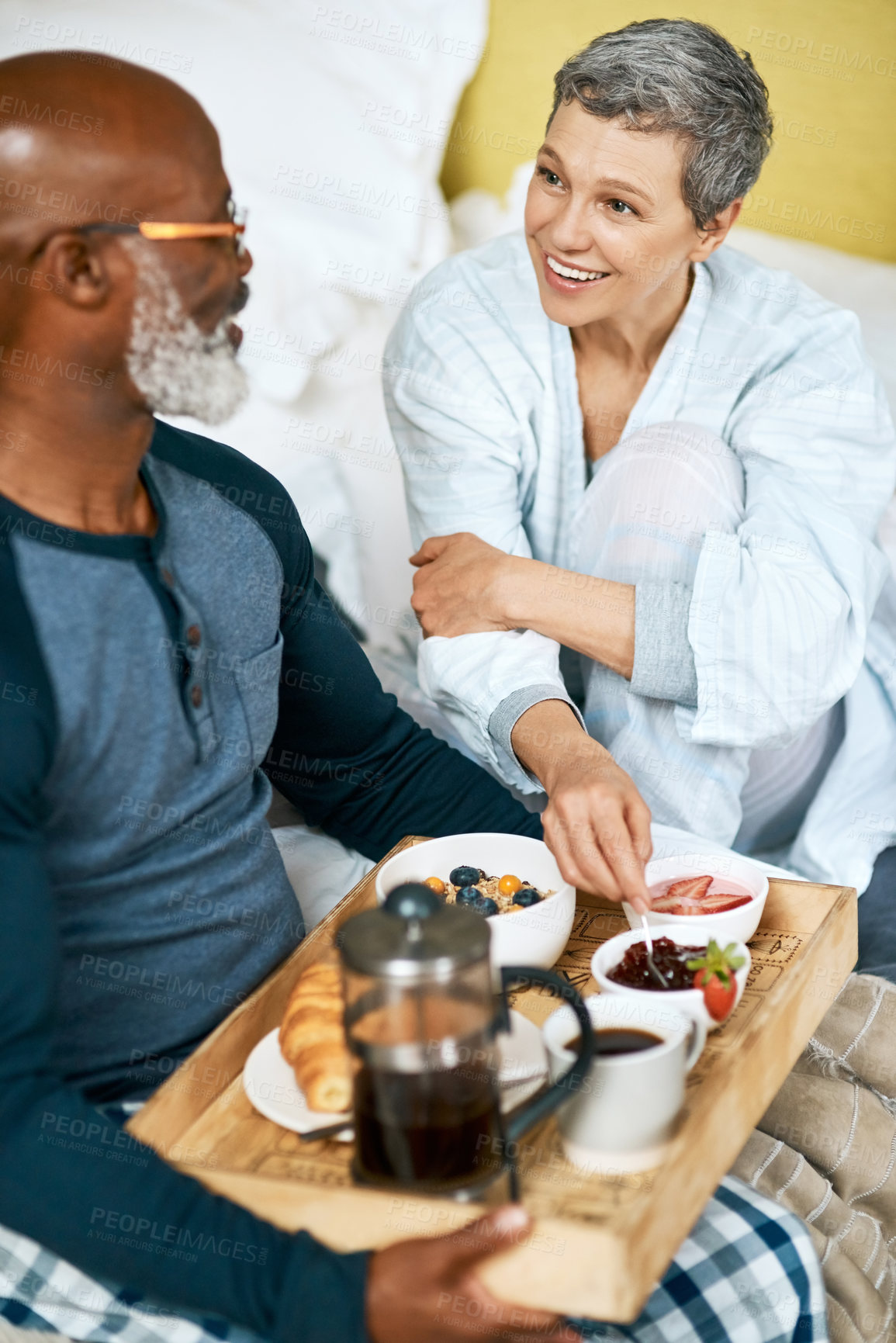 Buy stock photo Shot of a senior married couple having breakfast at home