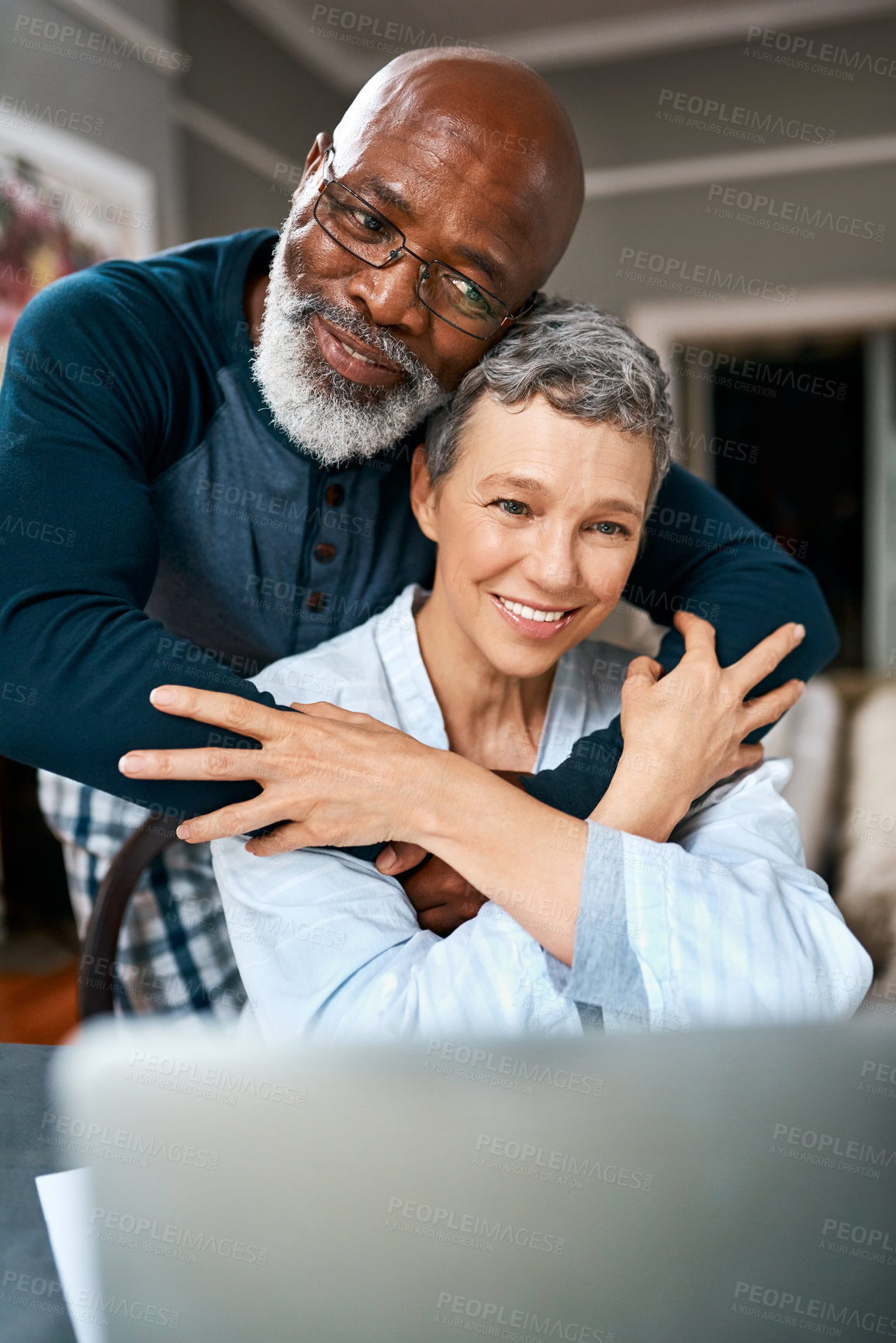 Buy stock photo Shot of a senior married couple using a laptop at home