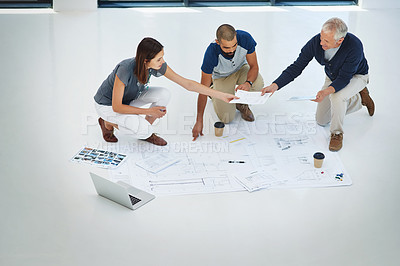 Buy stock photo Business people, architect and team with documents for planning, brainstorming or collaboration at office. Group of employees or civil engineers with paperwork or blueprint on floor for construction
