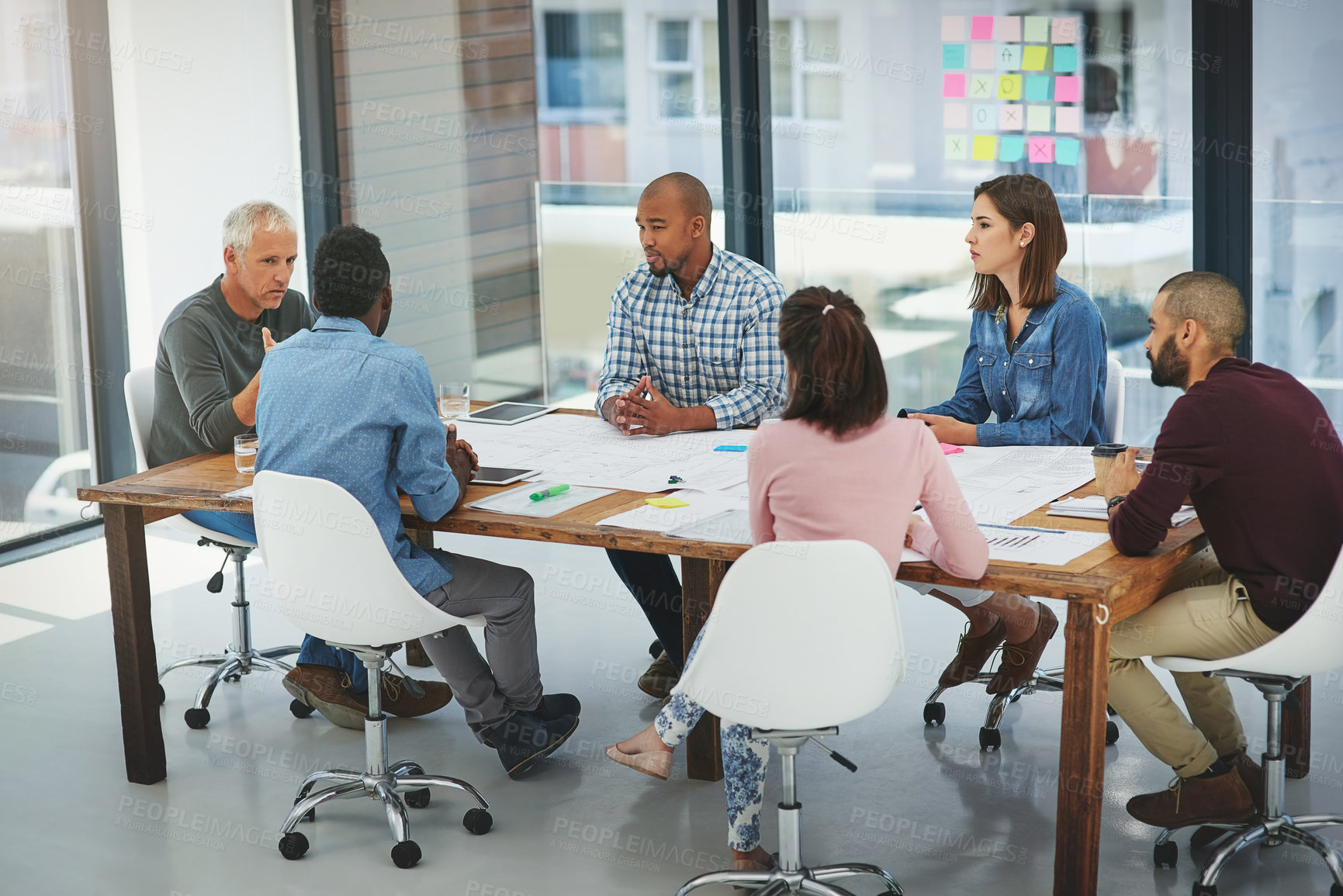 Buy stock photo Business people, meeting and discussion with team for collaboration, creative planning or brainstorming at office. Group of employees talking in boardroom, conference or ideas in startup at workplace