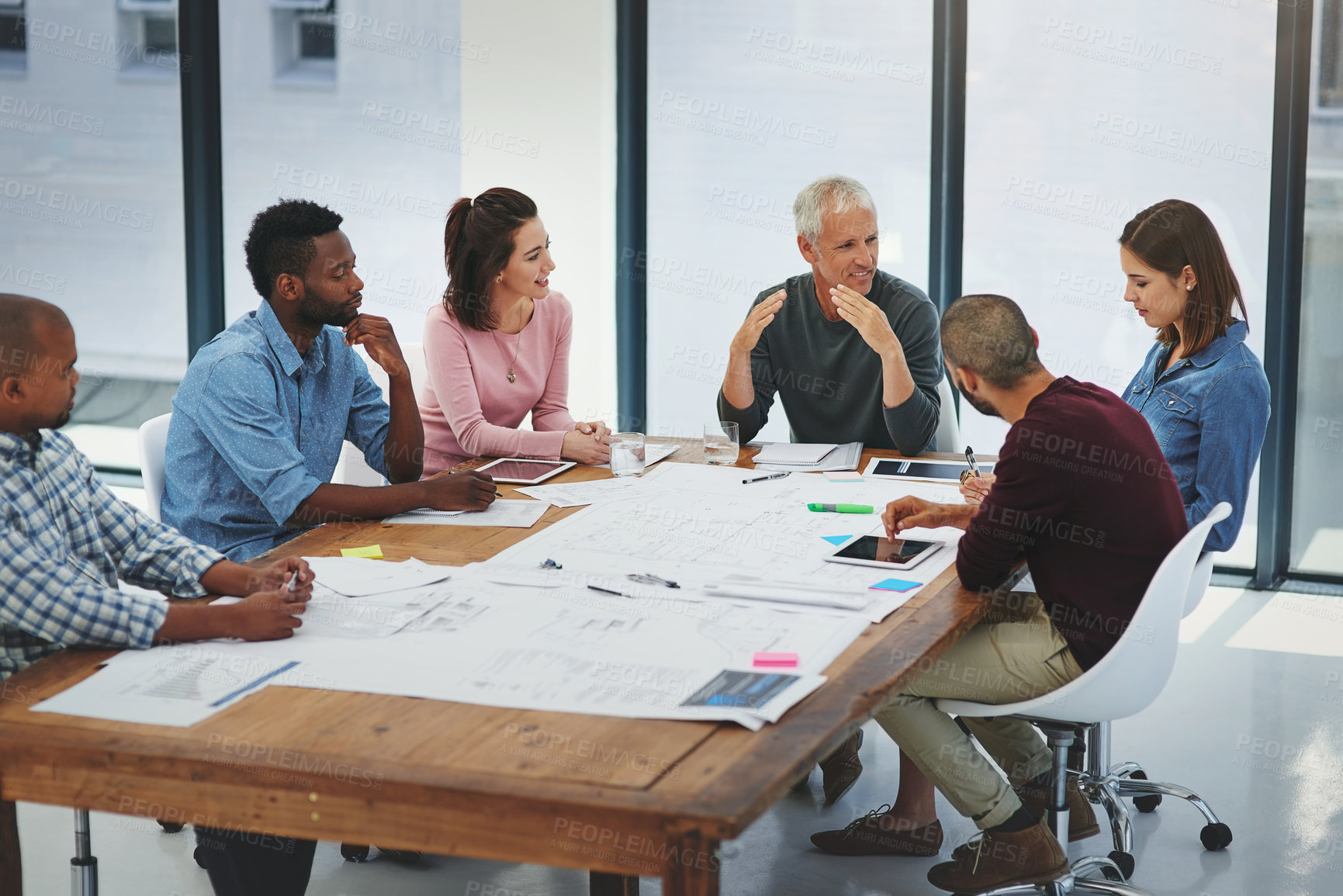 Buy stock photo Business people, architecture and discussion in meeting with blueprint for building design, brainstorming or planning. Architect, employee or collaboration with floor plan in boardroom with diversity