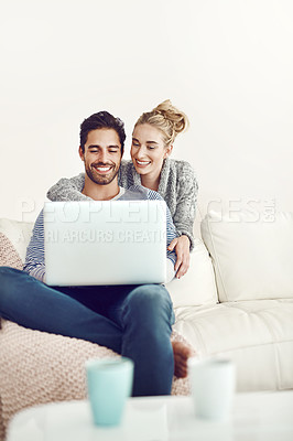 Buy stock photo Happy couple, ecommerce or laptop for option, reading news or movie streaming online on sofa in living room. Relax, internet or people on social network app on digital website or technology in home