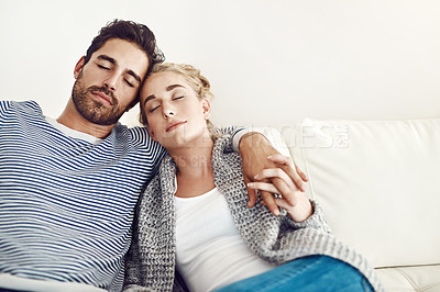 Buy stock photo Couple, sleep and hug together on sofa to relax, rest and cuddle in marriage, relationship or love for partner. Tired, man and woman dreaming with peace in home, house or living room in morning