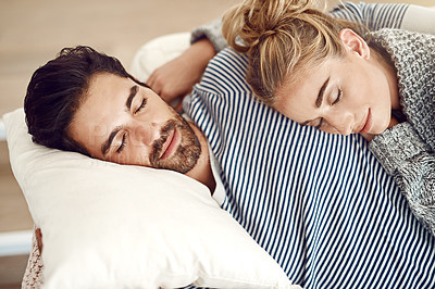 Buy stock photo Couple, rest and hug together on sofa to relax, sleeping and cuddle in marriage, relationship or love for partner. Tired, man and woman dreaming with peace in home, house or living room in morning