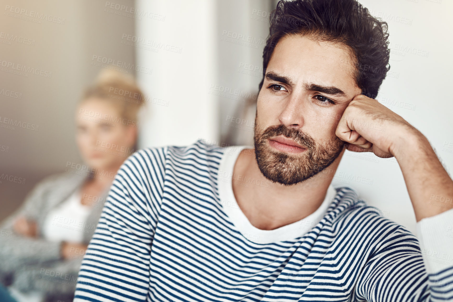 Buy stock photo Cropped shot of an unhappy young couple after a fight at home