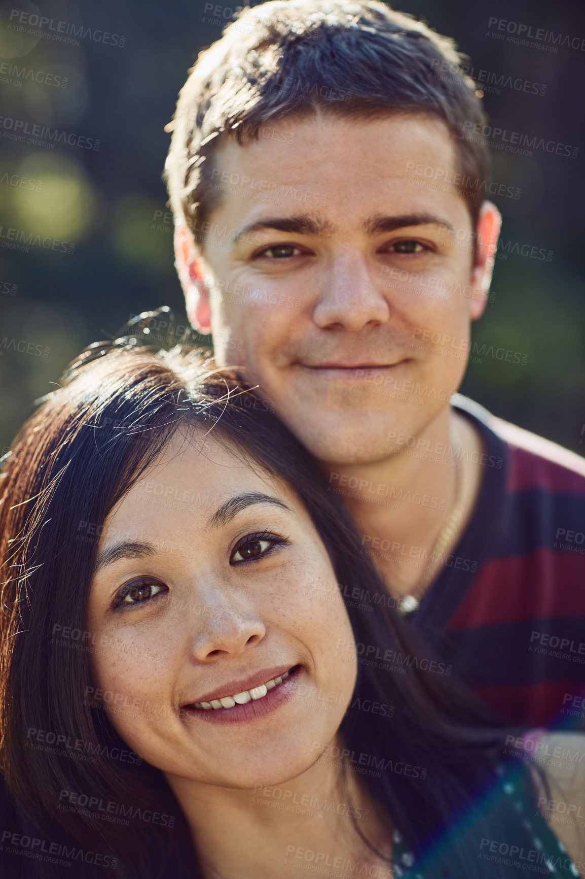 Buy stock photo Couple, smile and outdoor for portrait in park with care, love and bonding in spring sunshine. Man, woman and happy together with connection, holiday or relax with interracial relationship in Taiwan