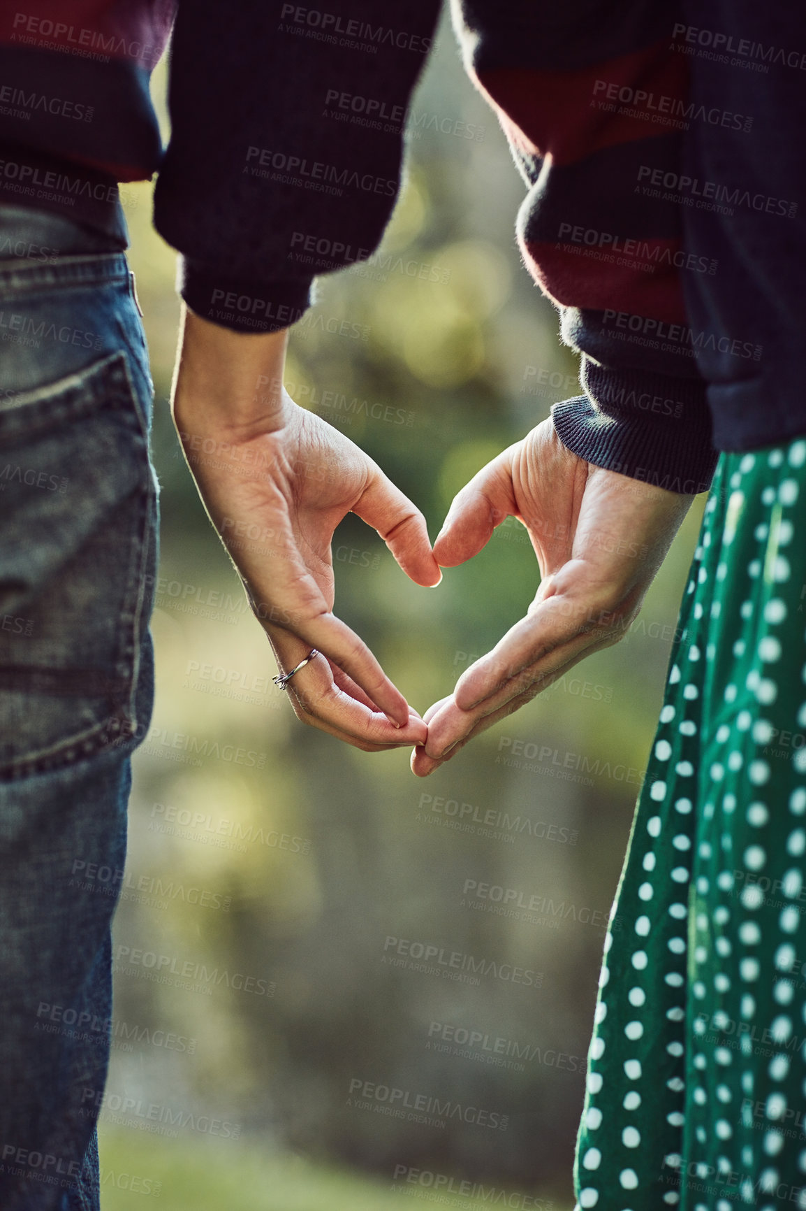 Buy stock photo Hands, couple and heart for love in outdoor with partnership, commitment and support of romance wellness. People, peace and connection with icon trust, hope and teamwork together in nature vacation