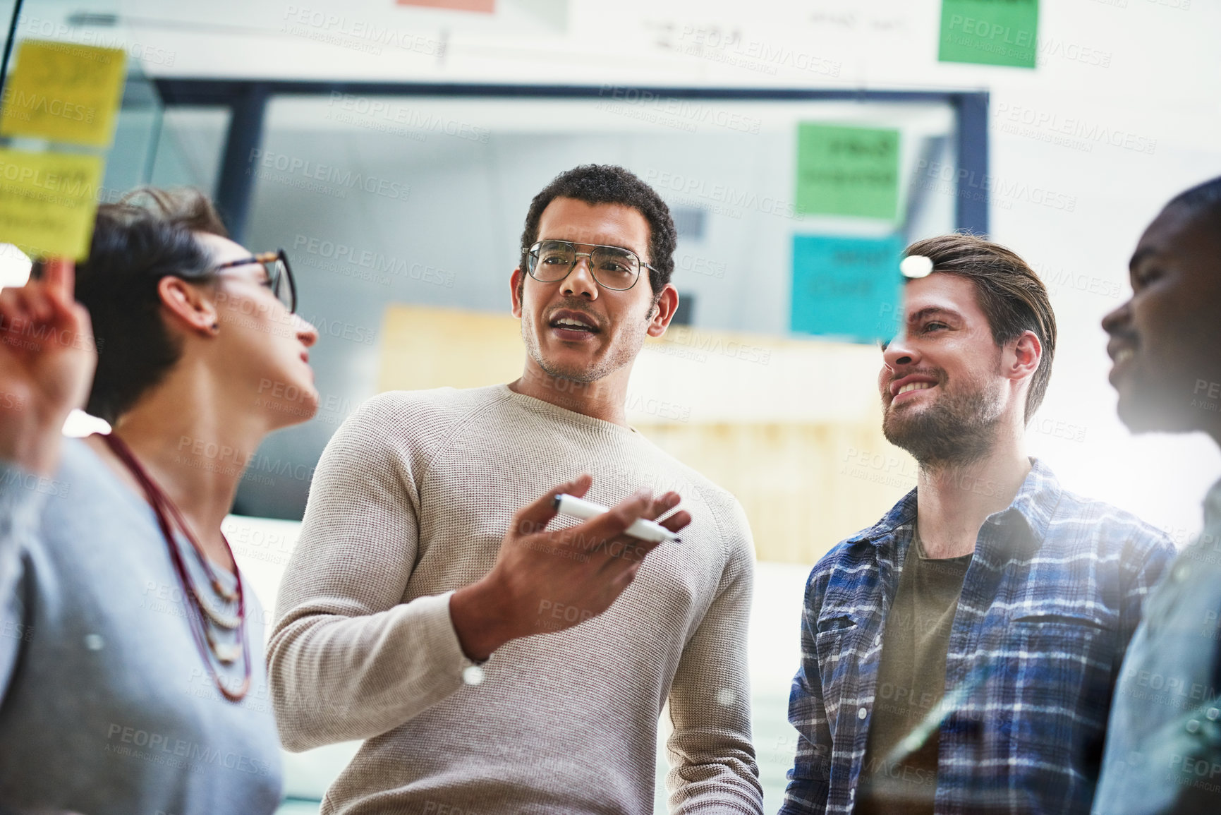 Buy stock photo Office, employees and discussion on glass wall for strategy with teamwork, collaboration and planning. Brainstorming, ideas and vision for project with sticky notes for solution as web developer