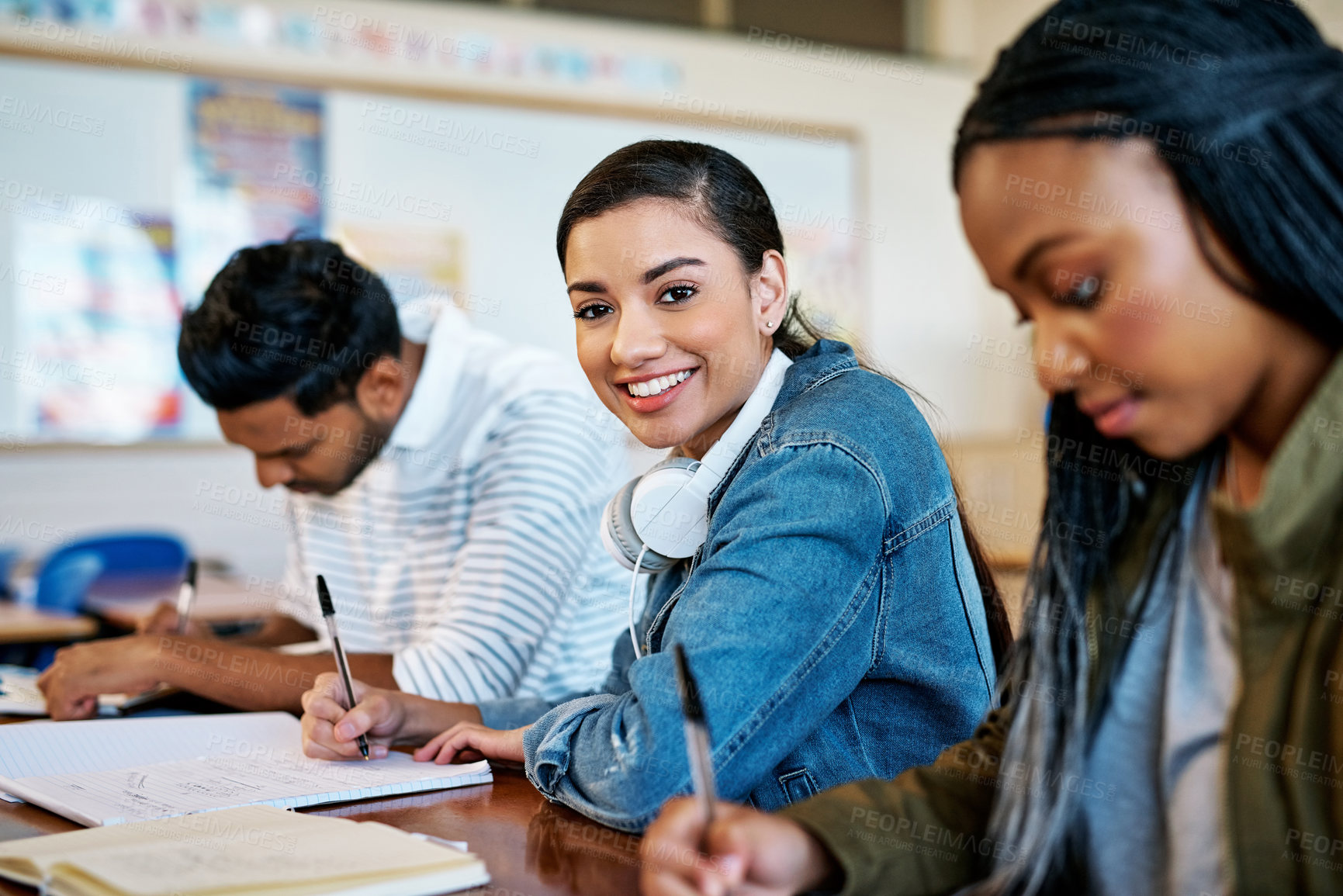 Buy stock photo Laptop, music and portrait of girl student in class at college or university for education and research. Computer, headphones and writing with happy scholar in school classroom for online assessment