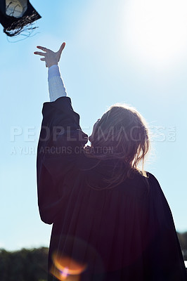 Buy stock photo Success, university and woman with graduation cap in sky for celebration, professional achievement and education. School, opportunity and excited college student with hat in air on campus from back