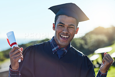 Buy stock photo Portrait of a young student holding his diploma on graduation day