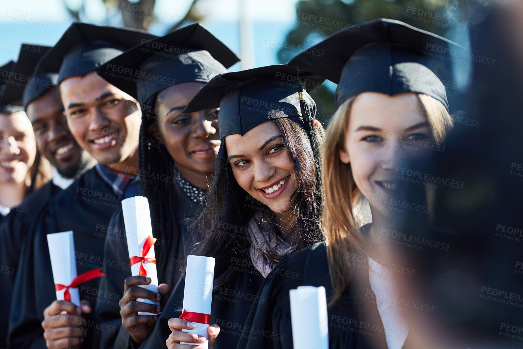 Buy stock photo Success, students and portrait of people at graduation with smile, achievement or education on camera. Photography, women and men with diploma, diversity or happy university friends at award ceremony