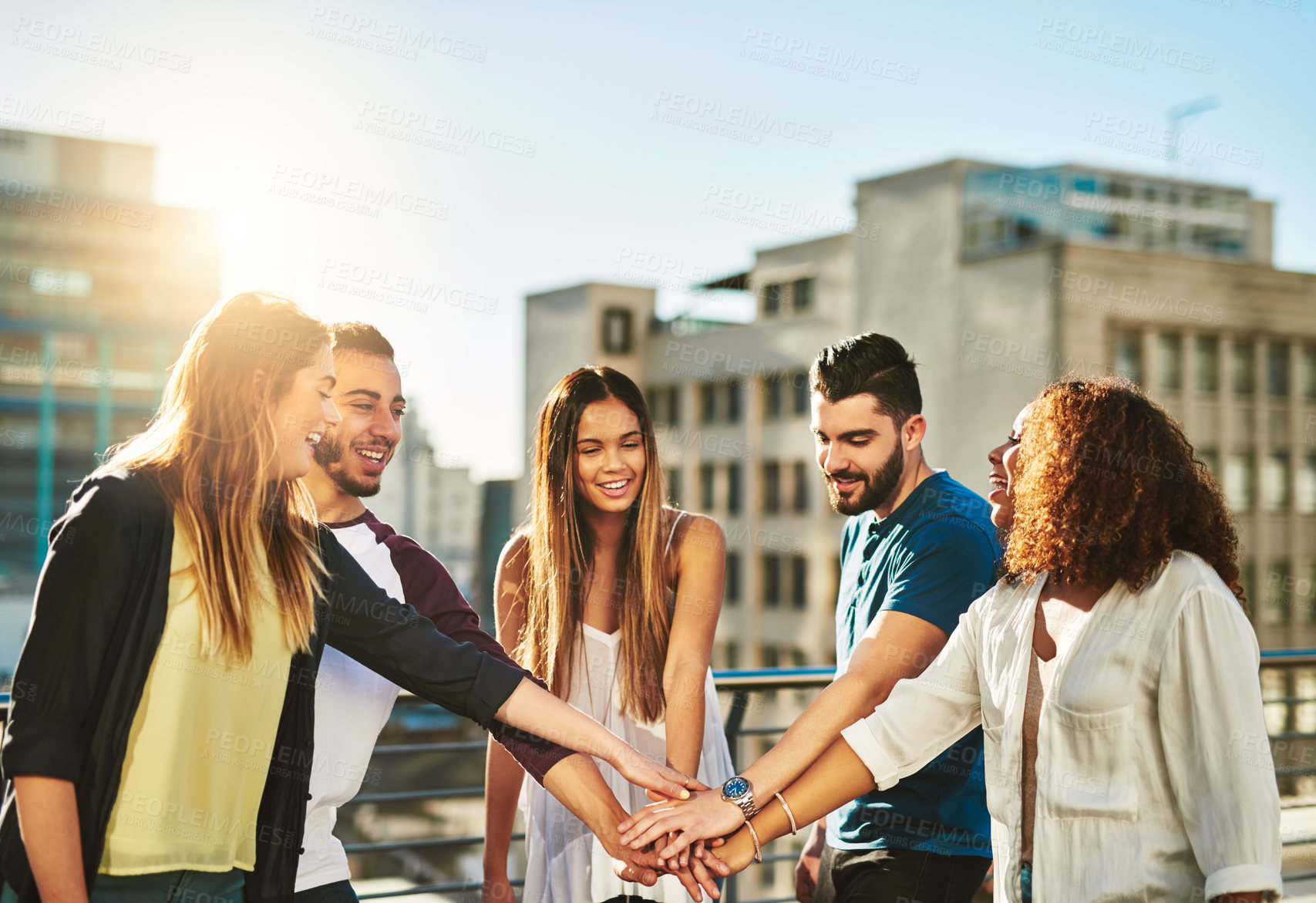 Buy stock photo Outdoor, hands together and group of people for solidarity, trust or celebration for vacation by sunshine. Happy friends, men and women with huddle for support, motivation or travel in city of Brazil