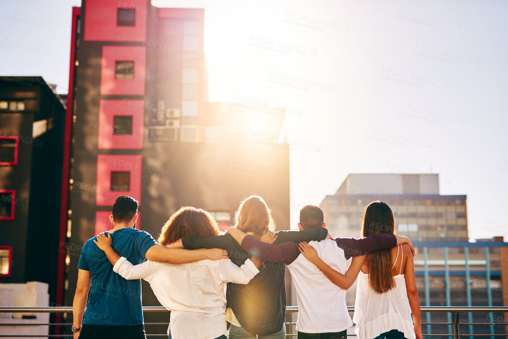 Buy stock photo Back, people and city with hug on balcony for holiday, travel or weekend together in an urban town. Group, friends or friendship with unity, solidarity or team for vacation, tourism or rooftop event