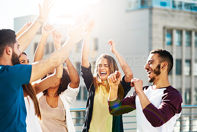 Buy stock photo Shot of young friends spending the day outside