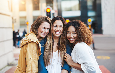 Buy stock photo Cropped shot of three friends having fun in the city