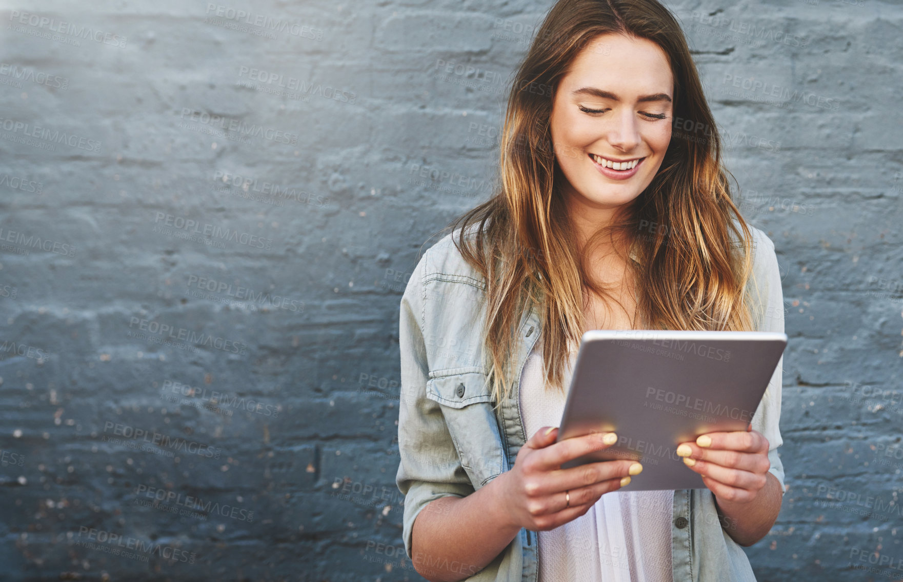 Buy stock photo Mockup, smile and tablet with designer woman on brick wall background for creative research. Innovation, space and technology with happy employee outdoor on space for professional web development