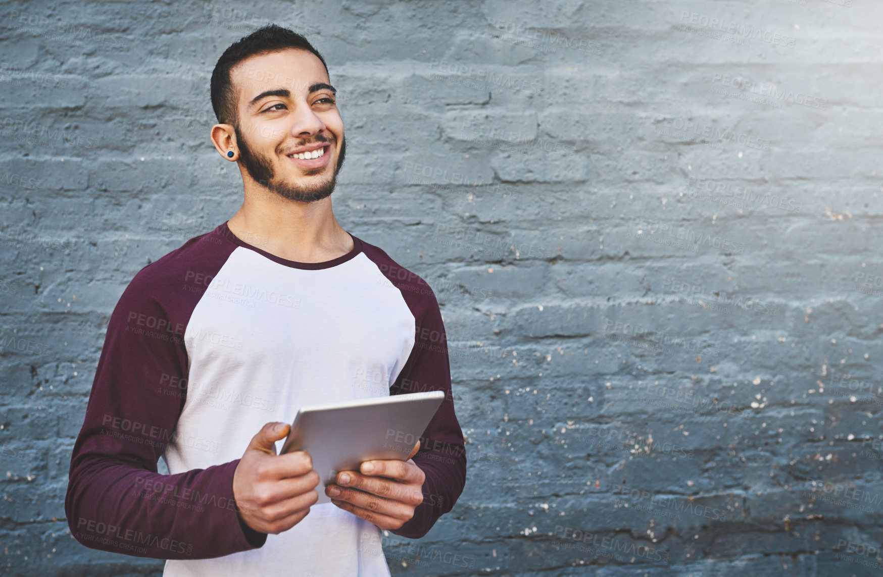 Buy stock photo Planning, smile and tablet with designer man on brick wall background for creative research. Project management, technology and thinking with happy employee on space for professional web development