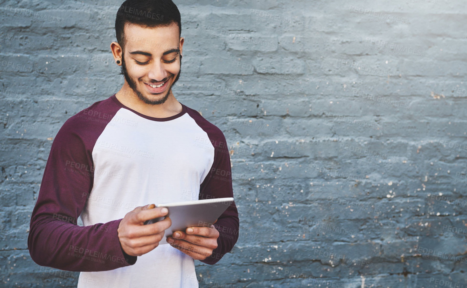 Buy stock photo Happy, mockup and tablet with designer man on brick wall background for creative research. Internet, space and technology with happy employee outdoor on space for professional web development