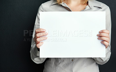 Buy stock photo Studio, woman and hand with board for advertising design, poster or marketing info on mockup. Female person, blank paper and banner with space for branding, news and promotion on black background