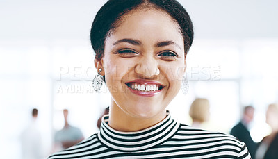 Buy stock photo Cropped portrait of an attractive young businesswoman standing in the office with her colleagues in the background