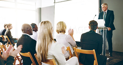 Buy stock photo Cropped shot of a handsome mature businessman giving a speech during an award ceremony