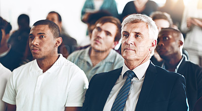Buy stock photo Cropped shot of a group of corporate businesspeople sitting in an auditorium during an award ceremony