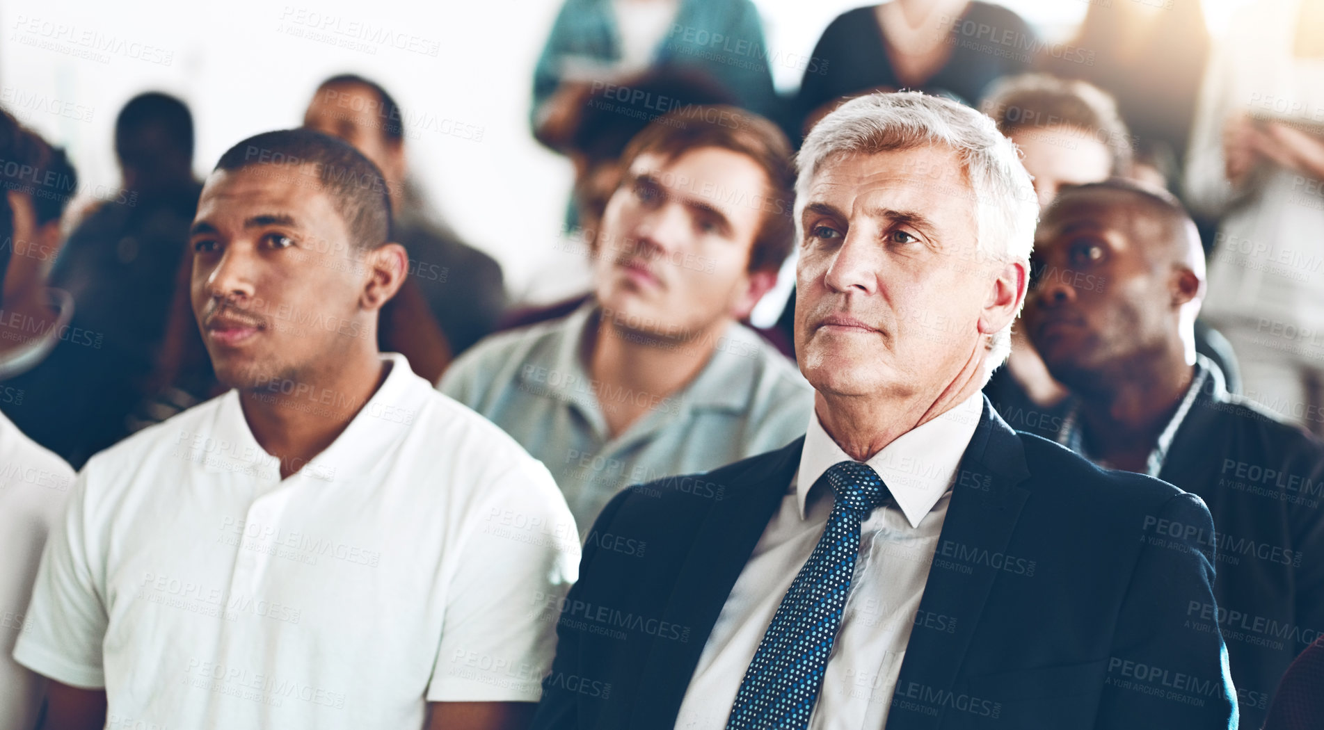 Buy stock photo Cropped shot of a group of corporate businesspeople sitting in an auditorium during an award ceremony