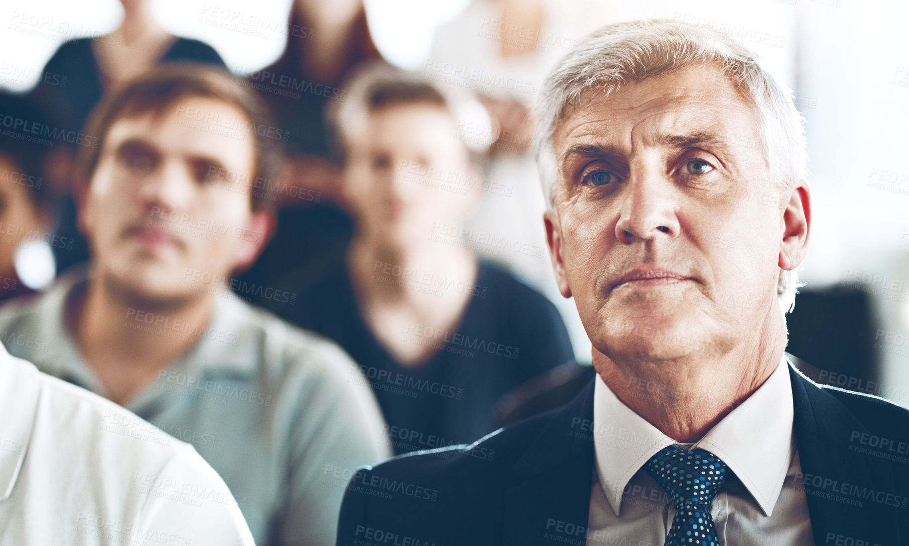 Buy stock photo Cropped shot of a group of corporate businesspeople sitting in an auditorium during an award ceremony