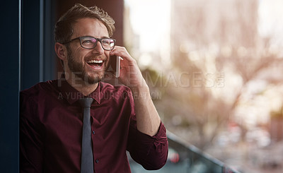 Buy stock photo Shot of a young businessman using a mobile phone on the balcony of an office