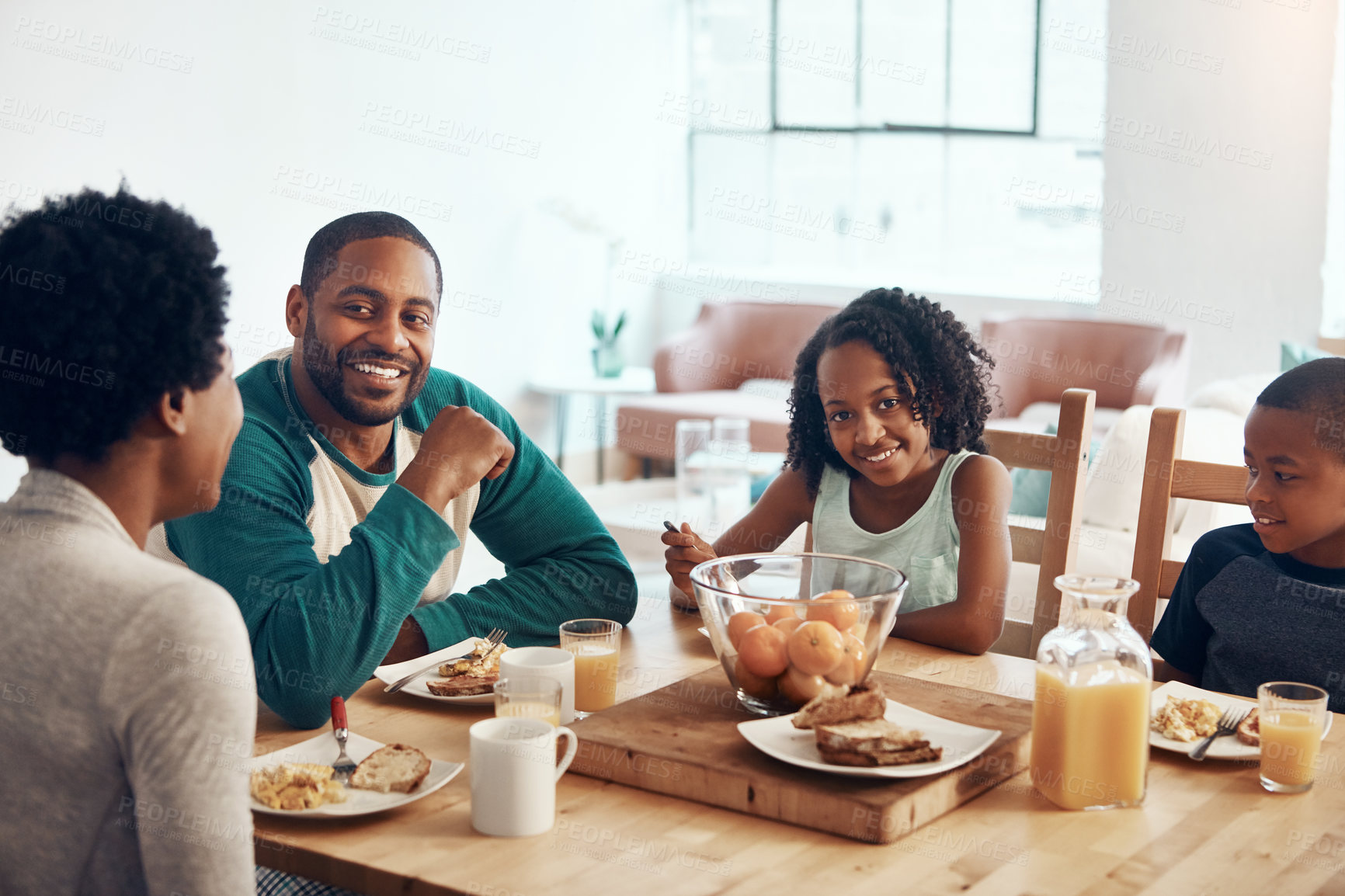 Buy stock photo Black family, parents and children for breakfast or eating in home with bonding, relax and happy in dining room. Love, mother and father with kids in morning with food, eggs and bread for nutrition