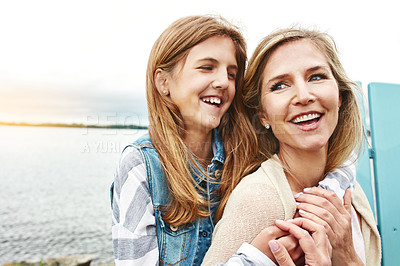 Buy stock photo Shot of a mother and her daughter bonding outdoors