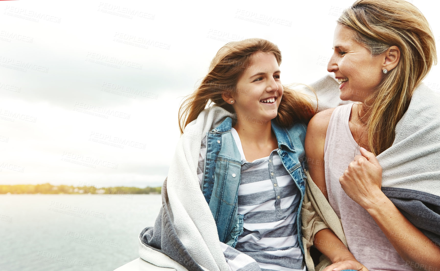 Buy stock photo Shot of a mother and her daughter bonding outdoors