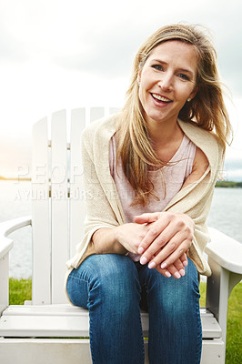 Buy stock photo Mature woman, relax and portrait outdoor for peace, holiday and travel by lake with happiness. Female person, calm and face in nature for vacation, summer or wellness by pond with smile or river