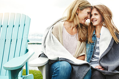 Buy stock photo Shot of a mother and her daughter bonding outdoors