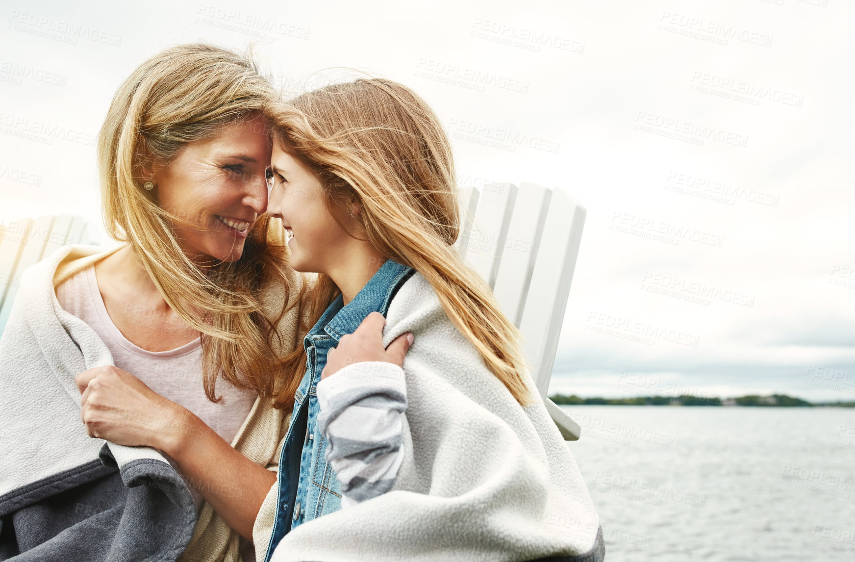 Buy stock photo Shot of a mother and her daughter bonding outdoors