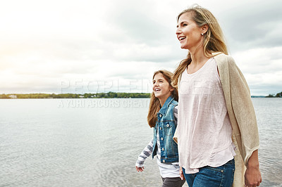 Buy stock photo Shot of a mother and her daughter bonding outdoors