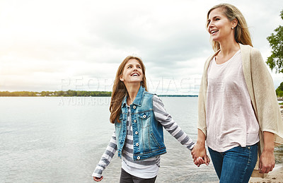 Buy stock photo Happy, holding hands or lake with mother and daughter outdoor in nature together for bonding. Family, love or smile with woman and girl child walking in green park for security, support or trust