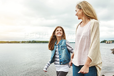 Buy stock photo Shot of a mother and her daughter bonding outdoors